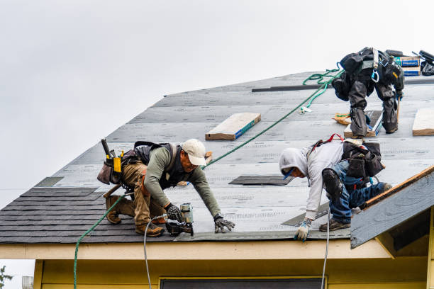 Professional Gutter Installation technician working in Achille, OK
